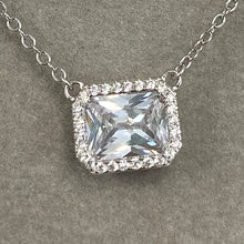 Inset Emerald Cut Halo Necklace