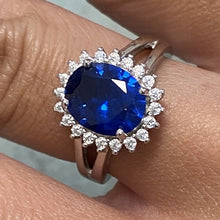 Oval Stone Sunburst Halo Ring
