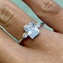 Emerald Cut with 2 Round Cubic Zirconia Ring