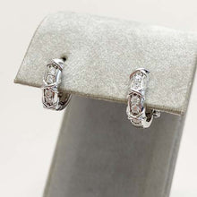 Cubic Zirconia Criss Cross & Channel Huggie Earrings